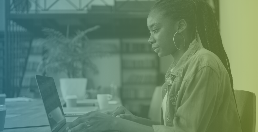 an image of a girl sat at a laptop